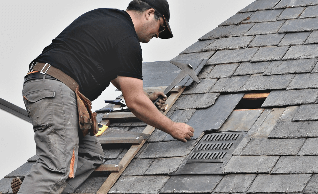 Close-up of asphalt shingles being replaced on a roof